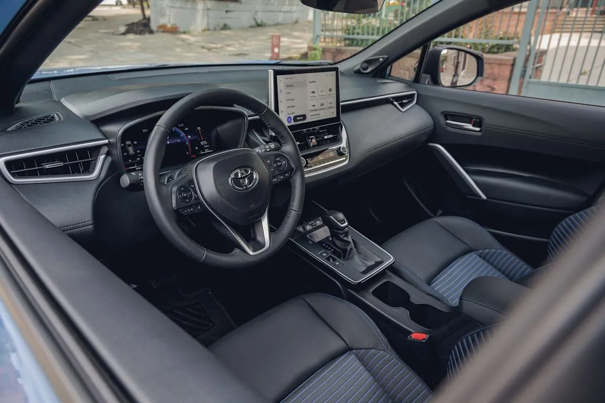 Interior cabin view of the 2026 Toyota Corolla Cross Hybrid displaying the dashboard and seating layout.