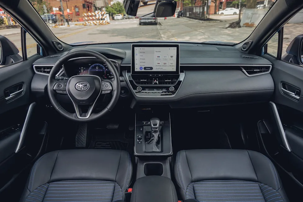 Interior cabin view of the 2026 Toyota Corolla Cross Hybrid displaying the dashboard and seating layout.