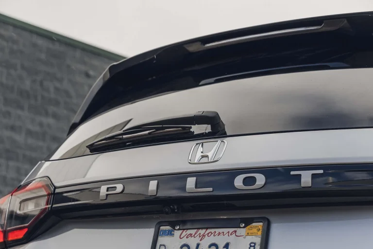 A side profile view of the Honda Pilot three-row crossover SUV