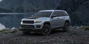 Front three-quarter view of the 2027 Jeep Grand Cherokee Upland trim with all-terrain tires