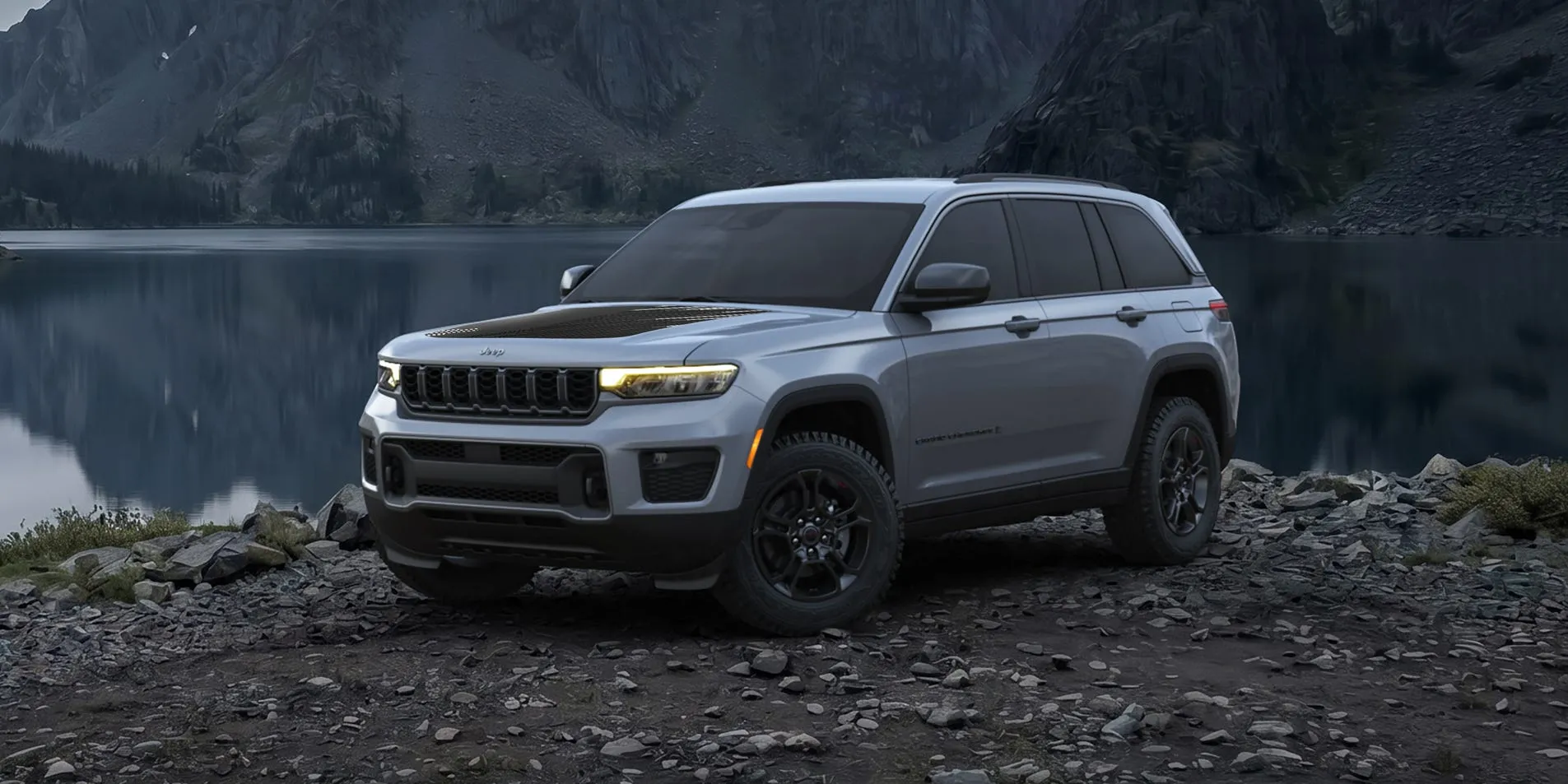 Front three-quarter view of the 2027 Jeep Grand Cherokee Upland trim with all-terrain tires