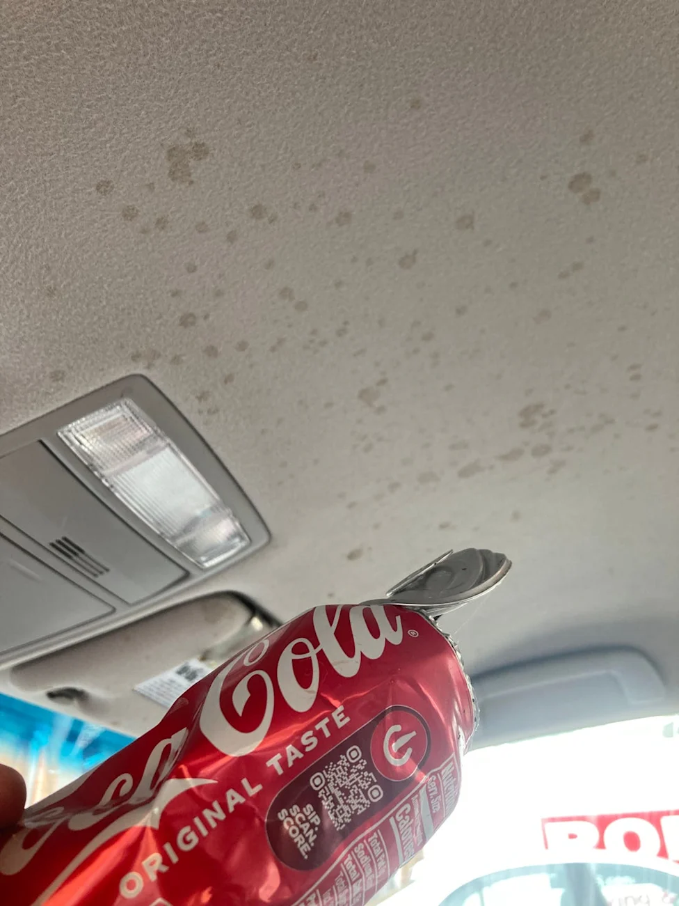 Kenmore Spotlite upholstery cleaner used to remove soda stains from a car headliner