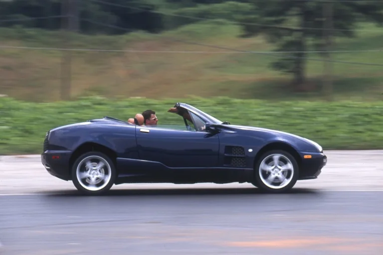 Side profile view of a 2001 Qvale Mangusta convertible