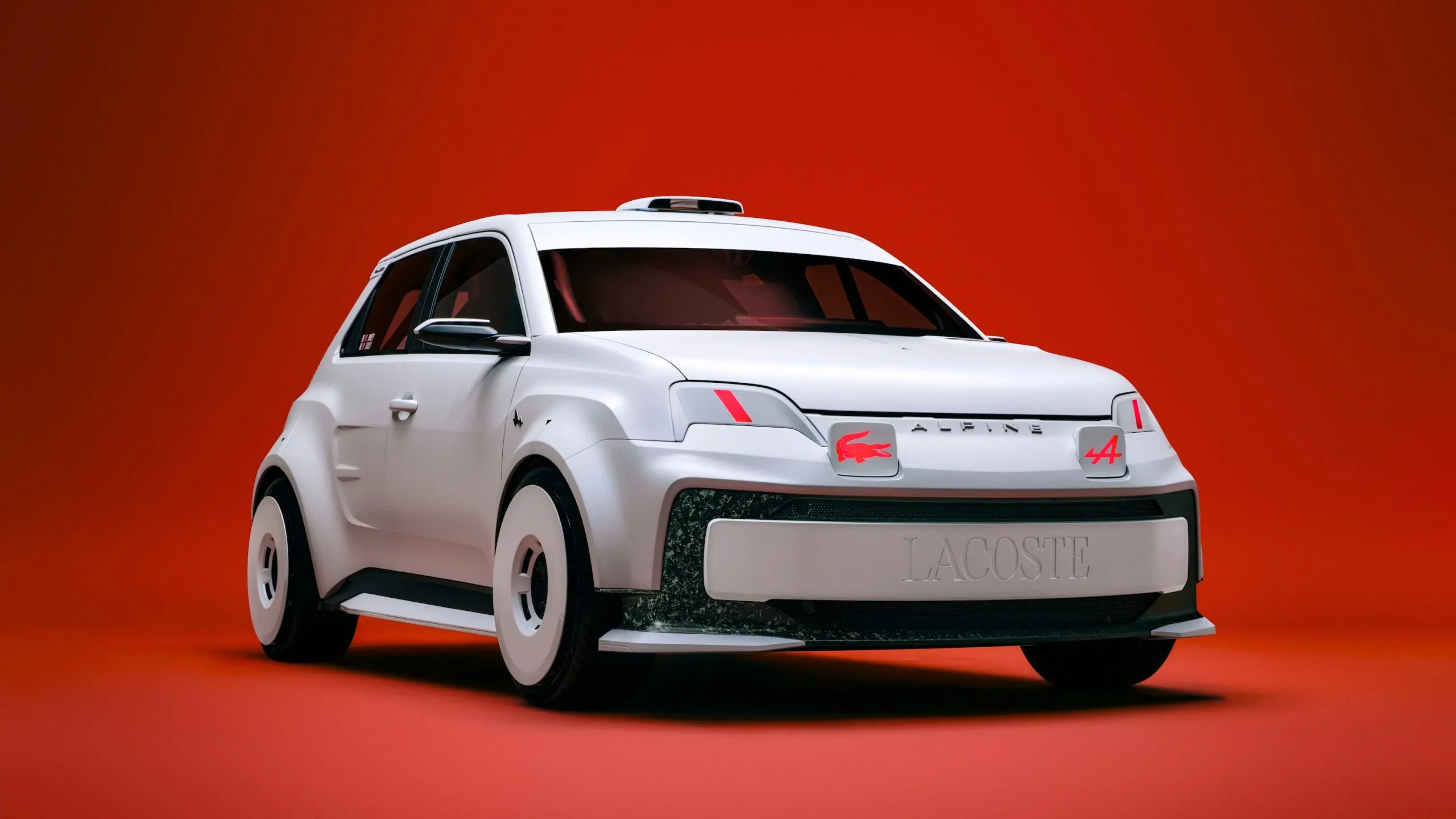The Alpine A290 Lacoste Rallye electric hot hatch featuring a matte white exterior and red crocodile design details on the