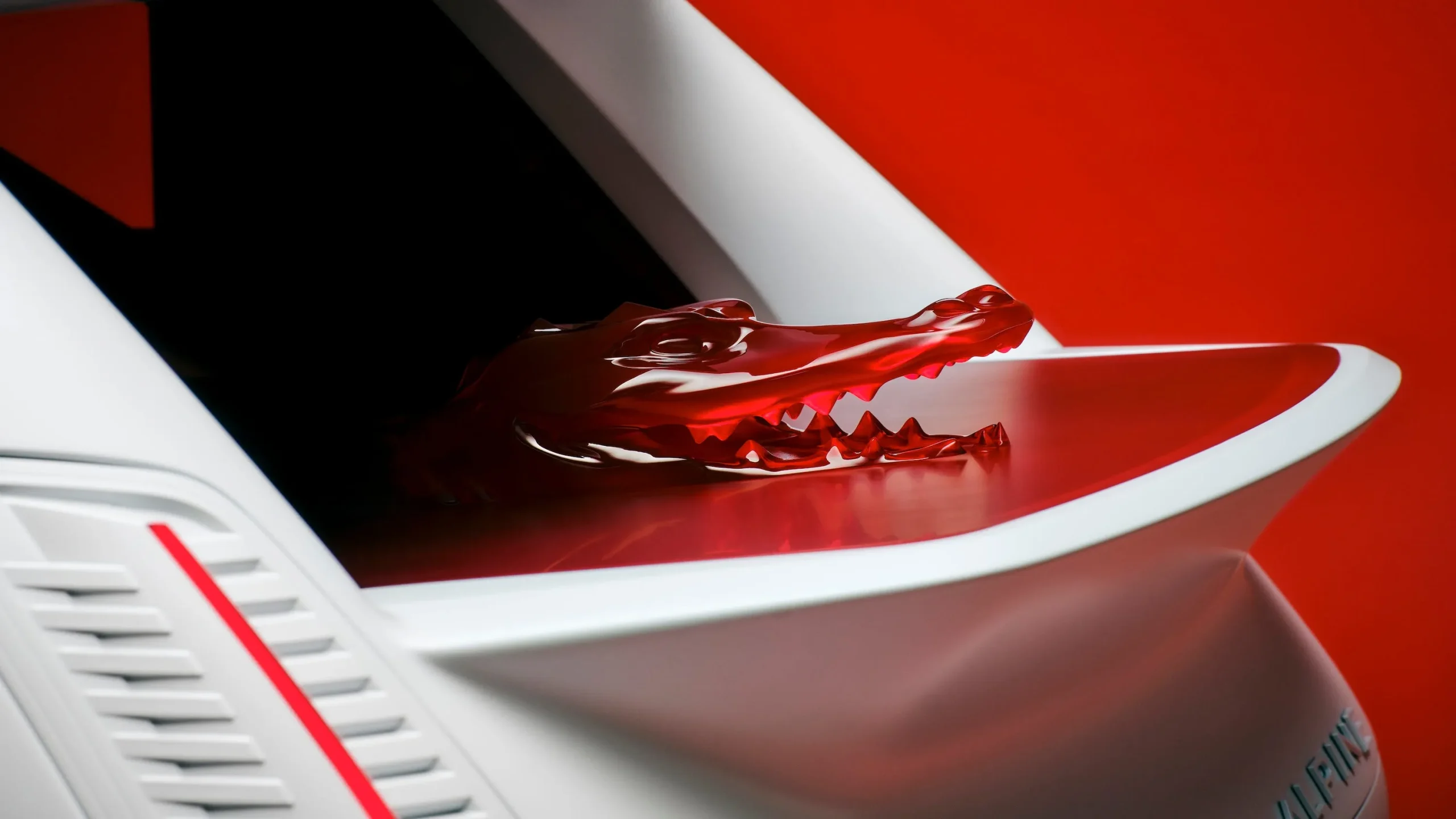 The Alpine A290 Lacoste Rallye electric hot hatch featuring a matte white exterior and red crocodile design details on the