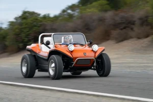 Electric Meyers Manx 2.0 driving on a scenic road