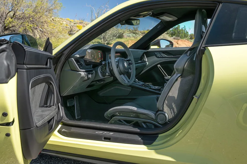 Interior view of the 2026 Porsche 911 GT3 featuring racing bucket seats and digital gauge cluster