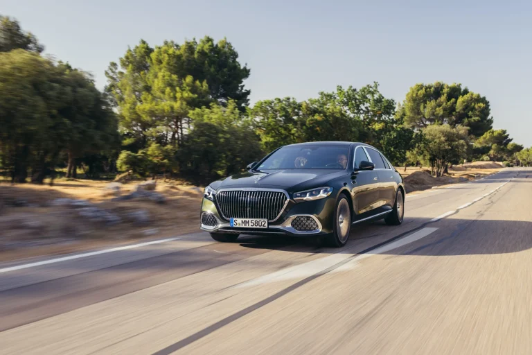 The 2027 Mercedes-Maybach S580 luxury sedan parked on a scenic road