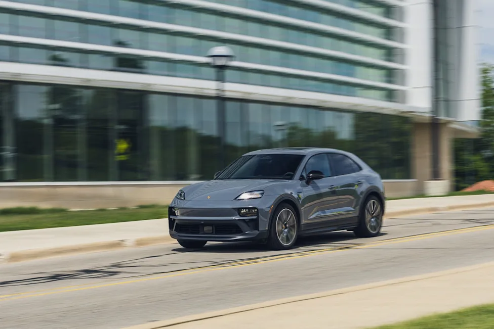The exterior of the sporty 2026 Porsche Macan GTS Electric featuring distinctive black accents and a lowered stance.