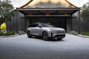 The front profile of a modern Toyota SUV representing the transition to the electric Highlander EV