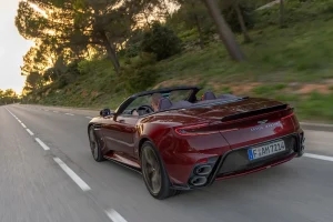 The front profile of the Aston Martin DB12 S Volante convertible parked on a scenic road