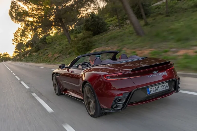 The front profile of the Aston Martin DB12 S Volante convertible parked on a scenic road