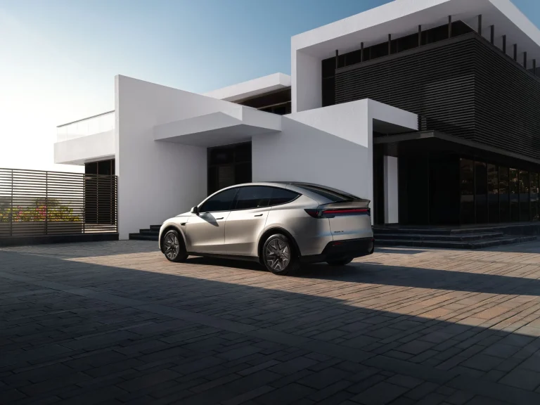 The profile of the new 2027 Tesla Model Y L highlighting its extended wheelbase and taller stance.