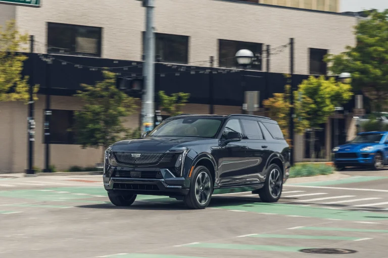 The side profile of the 2027 Cadillac Escalade IQ EV showcasing its massive size and sleek electric design.
