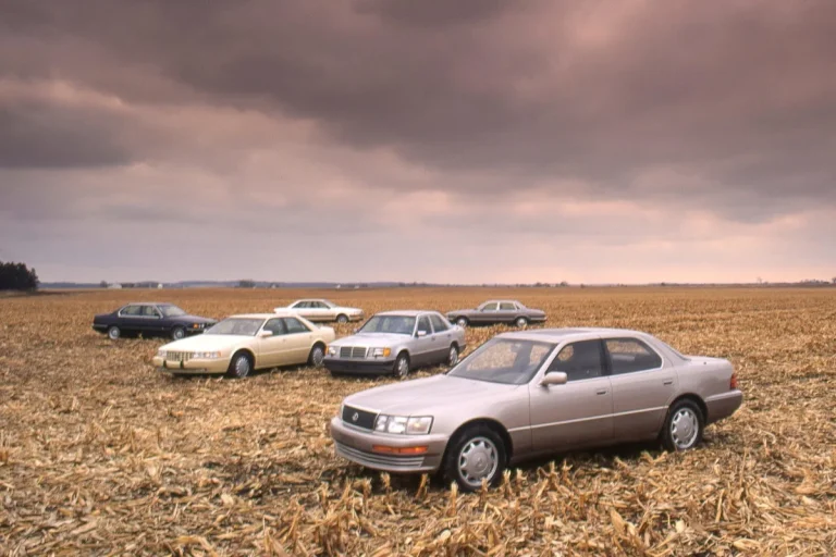A lineup of classic 1993 luxury sedans including BMW, Mercedes-Benz, and Lexus during a comparison test.