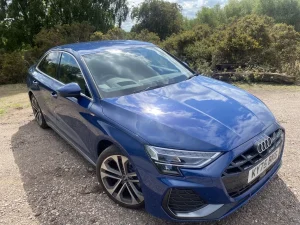 A sleek Audi A3 Saloon in optional Ascari Blue metallic paint showing its signature four rings grille