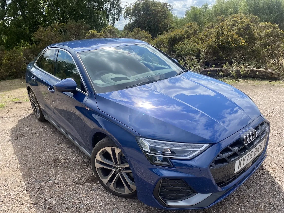 A sleek Audi A3 Saloon in optional Ascari Blue metallic paint showing its signature four rings grille