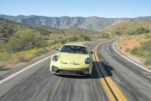 Exterior view of the Cartagena Yellow Metallic 2026 Porsche 911 GT3 showing its prominent rear wing.