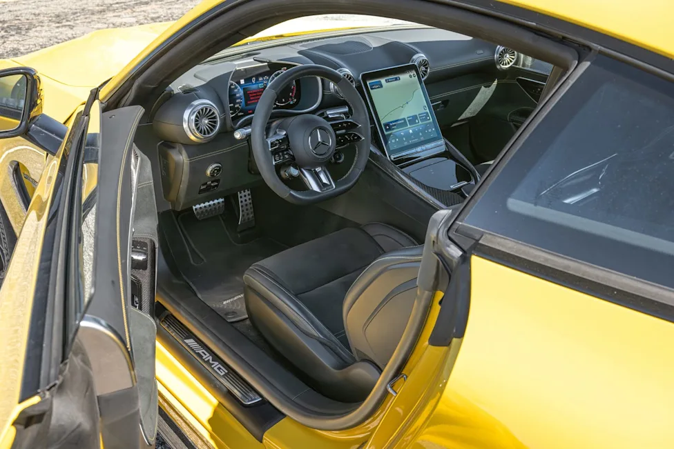 The modern high-tech dashboard and steering wheel of the 2025 Mercedes-AMG GT63 Pro.