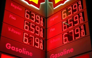 A gas station fuel pump showing high prices