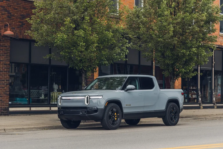 A modern Rivian electric vehicle parked outdoors showcasing its design.