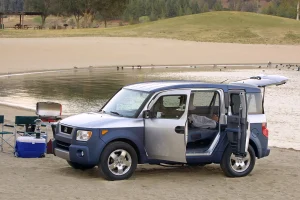 A vintage Honda Element parked in a scenic outdoor setting.