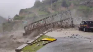 Debris and rushing floodwaters at Tamak drain after cloudburst in Uttarakhand Chamoli