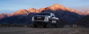 Front view of the 2027 GMC Sierra 1500 showing its muscular grille and headlight design