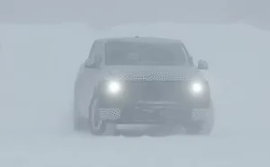 Prototype of the upcoming Ford electric pickup truck covered in camouflage