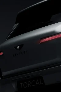 Rear teaser view of the upcoming Bentley Torcal electric SUV showing its diamond-like taillights.