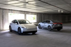 Side-by-side comparison of the 2026 Tesla Model Y RWD and the 2026 Toyota bZ XLE Plus electric SUVs.