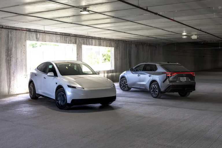 Side-by-side comparison of the 2026 Tesla Model Y RWD and the 2026 Toyota bZ XLE Plus electric SUVs.