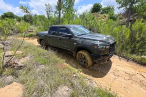 The 2027 Ram 1500 BackCountry and Rebel X parked in a rugged outdoor setting