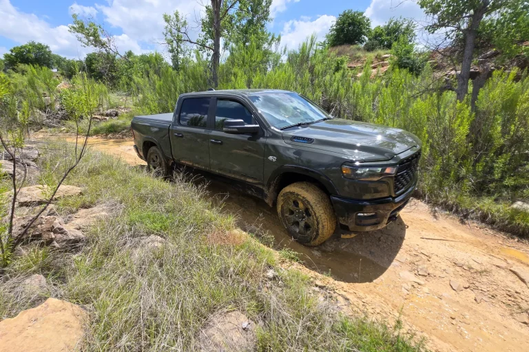 The 2027 Ram 1500 BackCountry and Rebel X parked in a rugged outdoor setting