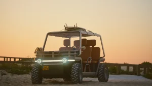 The Amble One electric beach buggy, a stylish and doorless luxury low-speed vehicle designed for resorts and short open-air