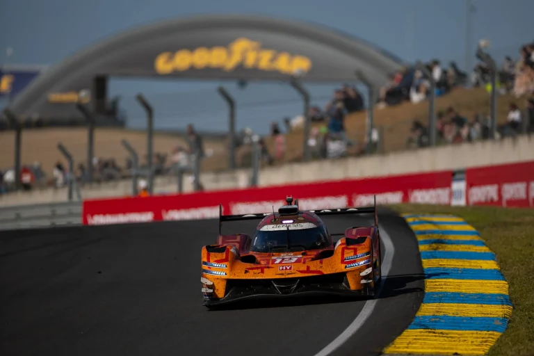 The Genesis Magma Racing GMR-001 hypercar competing on the track at the 24 Hours of Le Mans