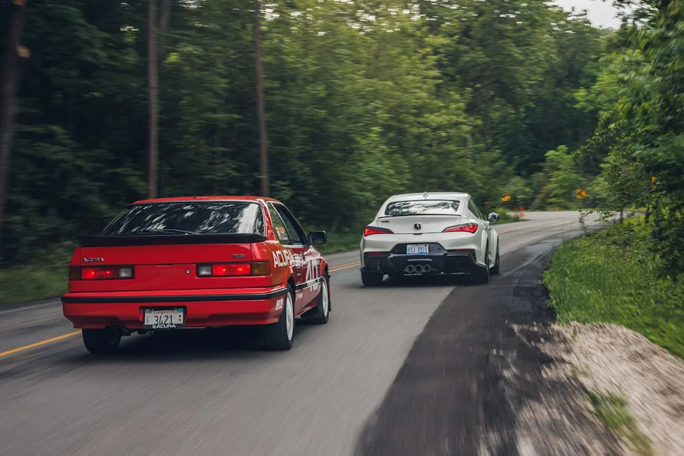 2024 Acura Integra Type S parked alongside historic Acura 40 Racer track car