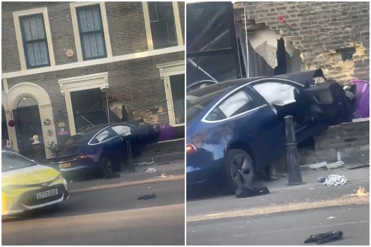 A blue Tesla Model 3 crashed into the brickwork of a Victorian townhouse in Bethnal Green, London