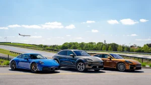 A collection of various Porsche models including the 911 and Taycan