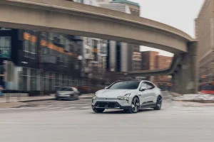 A gray Polestar 4 electric crossover parked on a paved road