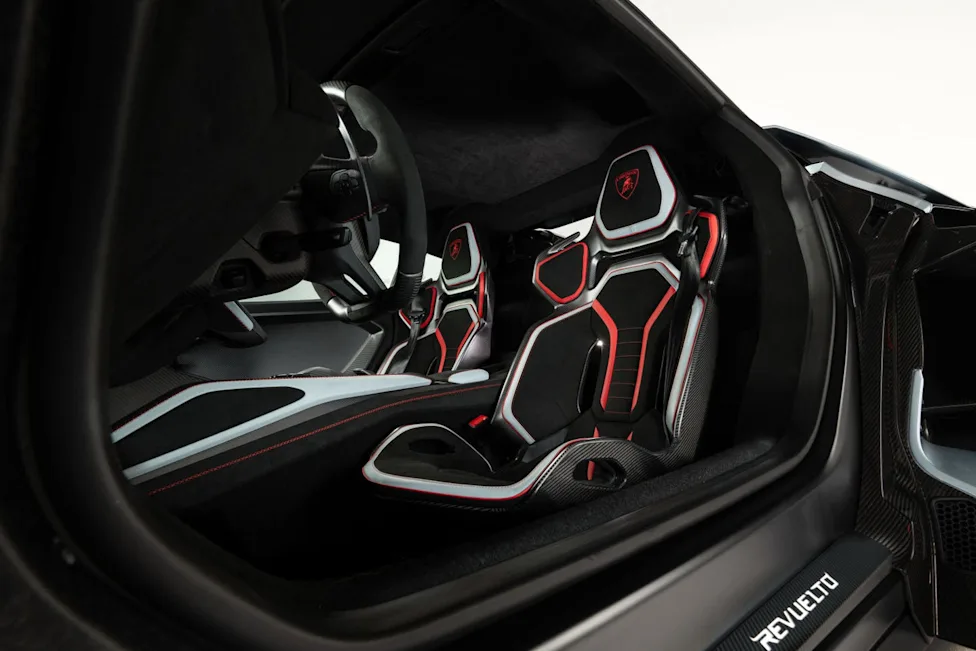 Interior cabin of the 2027 Lamborghini Revuelto SV featuring carbon-fiber bucket seats and digital displays