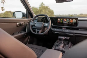 Interior view of the redesigned 2027 Kia Seltos showing dashboard and touchscreen display