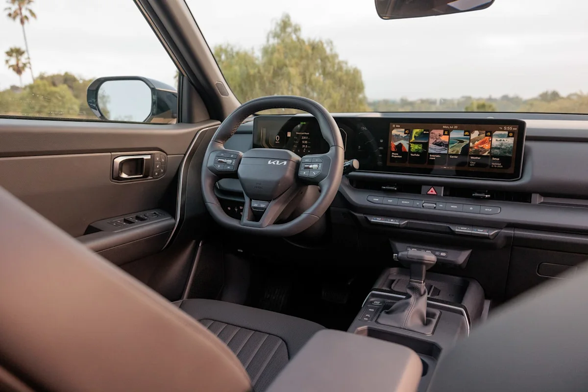 Interior view of the redesigned 2027 Kia Seltos showing dashboard and touchscreen display