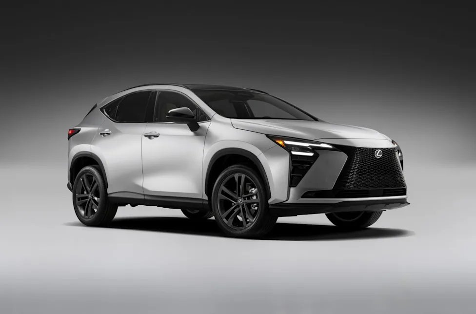 Rear three-quarter view of the silver 2027 Lexus NX Hybrid on a gray studio background with illuminated taillights