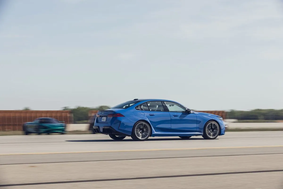 The 2026 BMW M5 performing a high-speed brake test on a track.