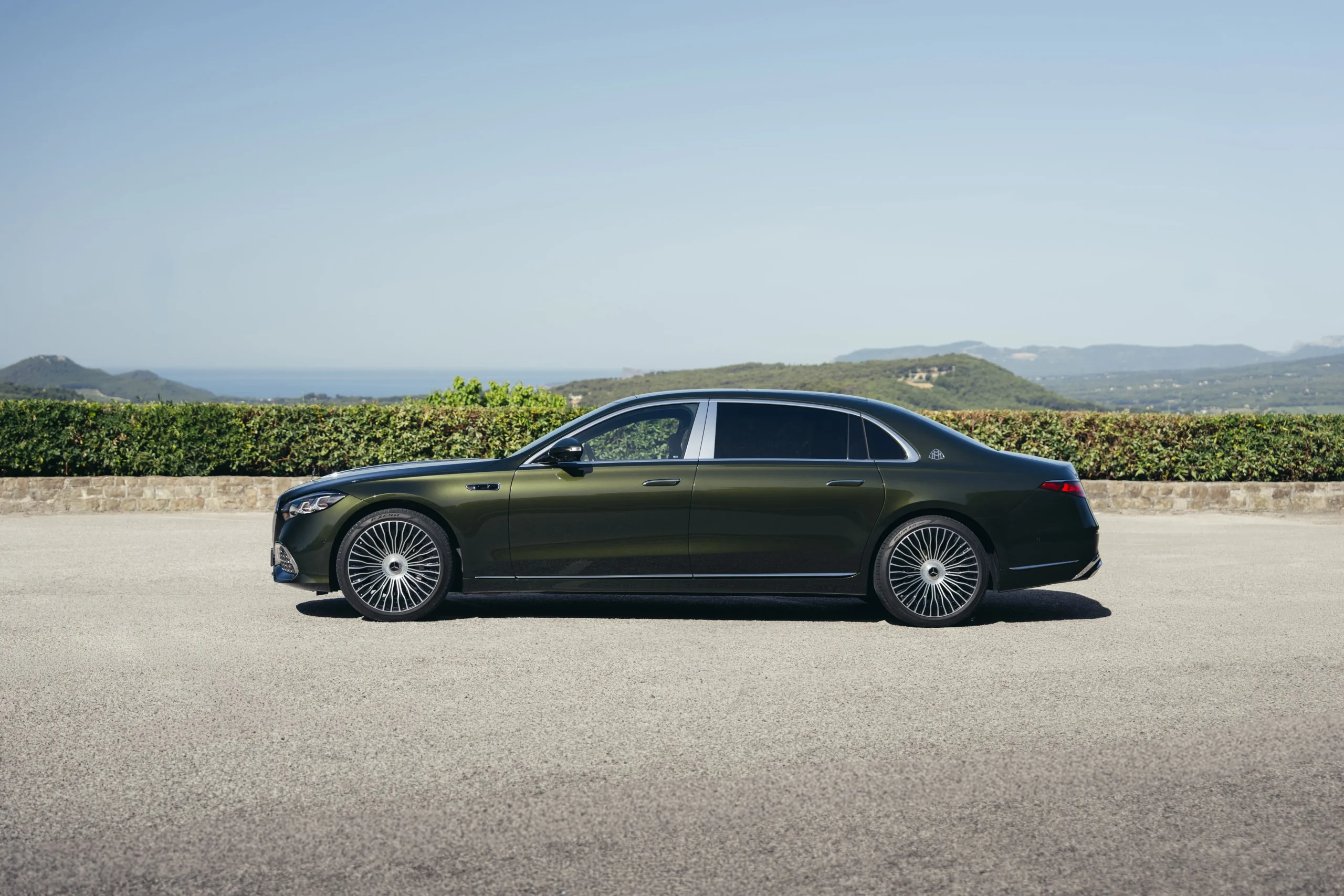 The front profile of the redesigned 2027 Mercedes-Maybach S-Class luxury sedan highlighting its larger illuminated grille