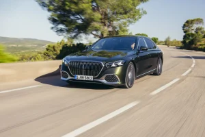 The front profile of the redesigned 2027 Mercedes-Maybach S-Class luxury sedan highlighting its larger illuminated grille