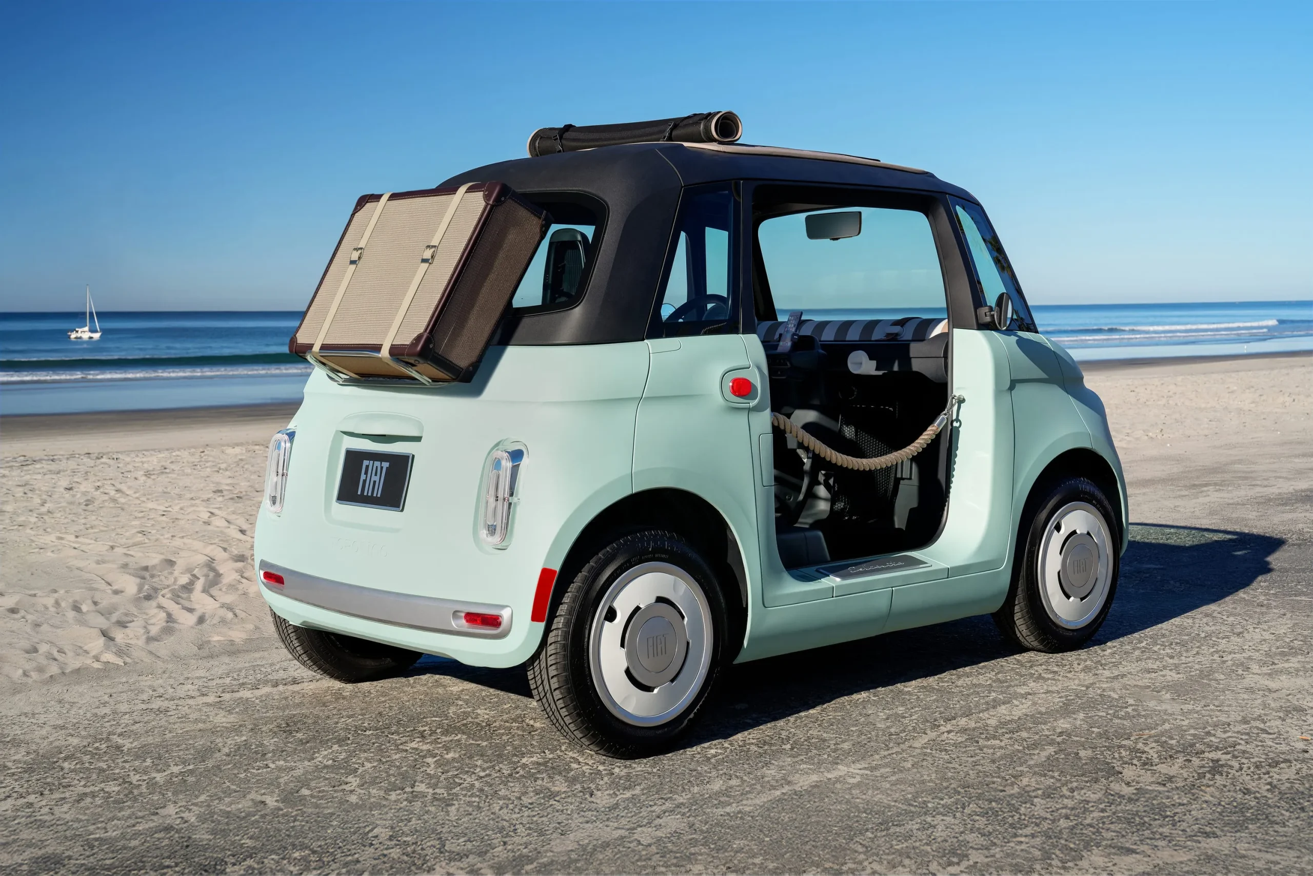 The green US-spec Fiat Topolino EV showing its retro design and compact dimensions
