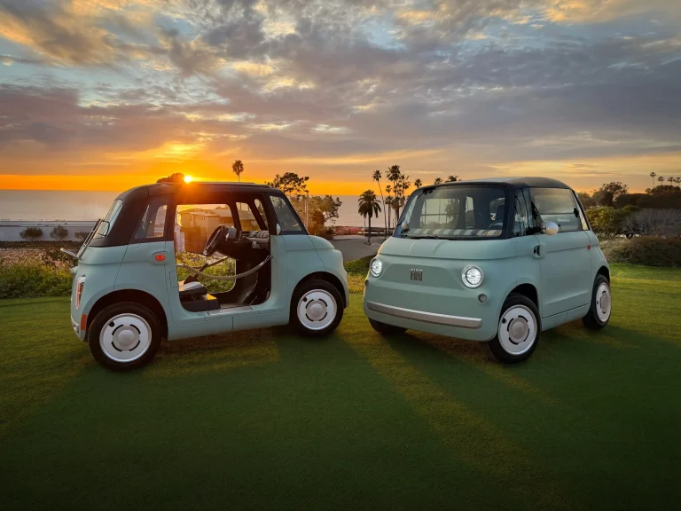 The green US-spec Fiat Topolino EV showing its retro design and compact dimensions