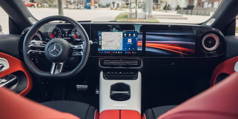 The interior cockpit of the 2026 Mercedes-Benz CLA250 Plus featuring the wide Superscreen display.